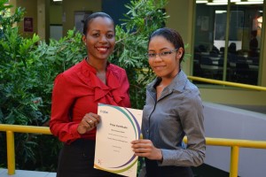 Hailyanna and Ms. Grant displaying the World Prize Certificate.